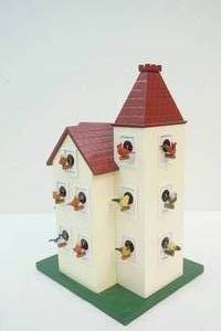 large decorative bird house with miniature birds