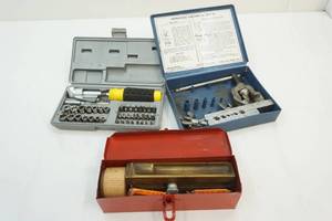 angle grinder, tube flaring kit and gasket cutter