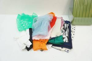 plastic container of fashion scarves