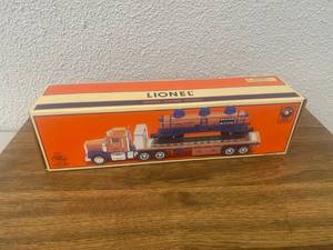lot 159 image: Lionel Flatbed Toy Truck with Operating 3-Dome Tank Car