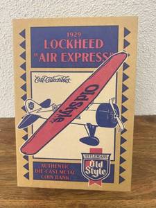 lot 242 image: Old Style 1929 Lockheed Air Express Airplane Bank