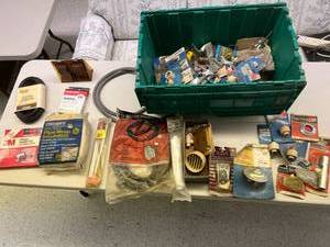 lot 285 image: Tote Full of Hardware Store Shelf Pulls