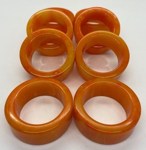 lot 110 image: Set of 8 Bright and Beautiful Orange Marble Bakelite Napkin Rings