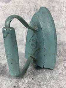 lot 130 image: Antique Flat Sad Iron  Door Stop - Painted Pale Aqua
