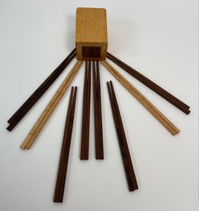 lot 203 image: Nine Pairs of Hand-Carved Chopsticks and Wooden Container