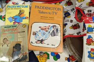 lot 174 image: Huge Vintage Paddington Bear Collectible All The Way from London 16 MM Reel Paddington Bear Show, Stickers, Clocks, Figurines, & Much More