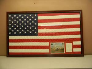 lot 24 image: Framed United States Flag - Carried on a combat mission over Baghdad, Iraq in a VH-60L Blackhawk Helicopter WITH CERT - FANTASTIC PIECE - NICE - APPROX 62 By 38 - SEE PICTURES