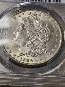 lot 16 image: 1885-O MORGAN SILVER DOLLAR MS65 PCGS