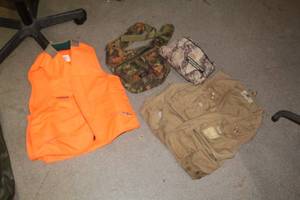 lot 759 image: Lot of (4) Sporting Wear - Columbia Vest Womens M Orange, Camo Pouch, The Original Bug Shirt Elite Edition, Black Sheep Vest Mens Size XL