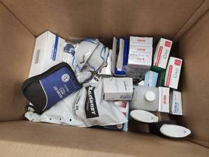 lot 52 image: Lot of  First Aid Supplies - Masks, Hydrogen Peroxide, Trauma Kit, Band Aids, Rubber Insulating Gloves, Finger Splints, and more