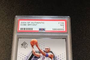 lot 17 image: 2004-05 SP Authentic Essentials Kobe Bryant #106 10702999 PSA 7  Only 2999 Exist