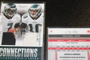 lot 71 image: Michael Vick Jersey Relic Football Card Lot  2 Jersey Cards