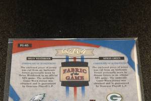 lot 103 image: 2005 Leaf Certified Materials Fabric of the Game Dual Jersey Brian Westbrook  Ahman Green 2102  Only 102 Exist