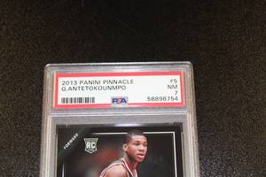 lot 138 image: 2013-14 Panini Pinnacle Giannis Antetokounmpo #5 Rookie Card PSA 7