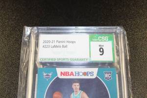 lot 183 image: 2020-21 Hoops LaMelo Ball #223 Rookie Card CSG 9