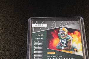 lot 204 image: 2019 Spectra Afterburners Neon Blue Prizm Jersey Relic Davante Adams #AB-5 7599  Only 99 Exist