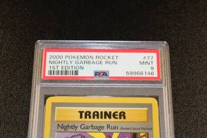 lot 219 image: 2000 Pokemon Team Rocket 1st Edition Nightly Garbage Run #77 PSA 9