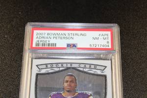 lot 242 image: 2007 Bowman Sterling Jersey Relic Adrian Peterson #APE Rookie Card PSA 8