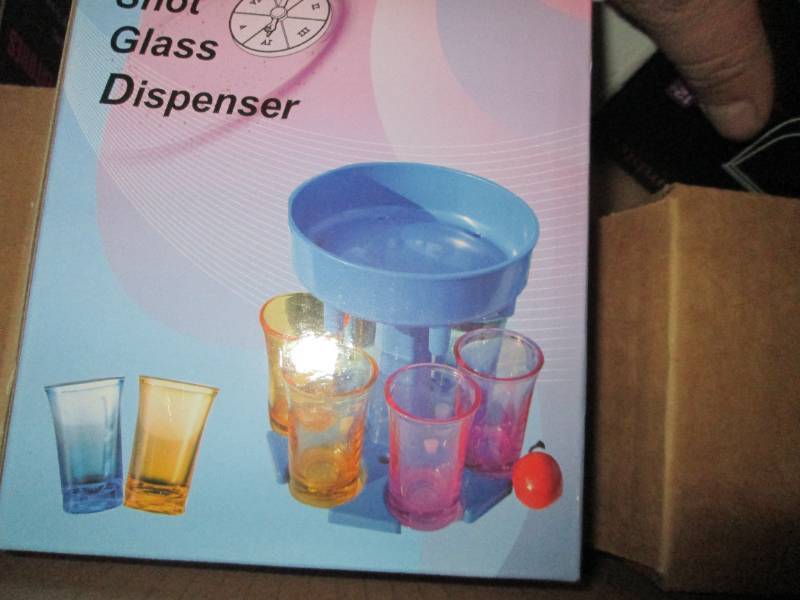 box of mugs , tumblers , pizza peel...
