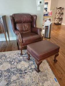 lot 49 image: Luxury Tacked Leather Armchair and Ottoman by Leathercraft