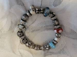 lot 42 image: Sterling Charm Bracelet by Pandora