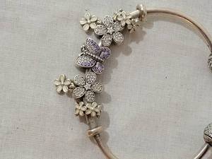 lot 42A image: Pandora Open Bangle Butterfly and Daisy Sterling Bracelet