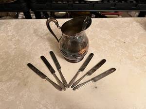 lot 705 image: Vintage F.B. Rogers Silver Company Silver-Plated Knives and Pitcher