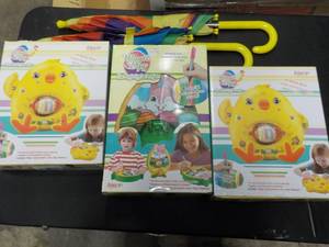 lot 275 image: Childrens Umbrellas and Magic Egg Kits