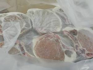 lot 435 image: 10 lb. Box Frozen Bone In Pork Chop...