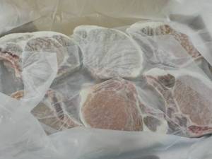 lot 439 image: 10 lb. Box Frozen Bone In Pork Chop...