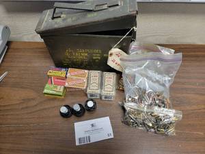 lot 51 image: 7 Boxes and 2 bags of .22 Winchester Ammo with three speed loaders in Green Ammo Box