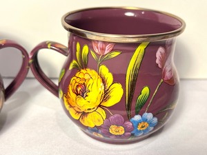 lot 72 image: Pair of Mackenzie Childs Enamel Purple Flower Market Mugs