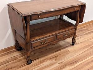 lot 337 image: Vintage Rolling Wood Buffet
