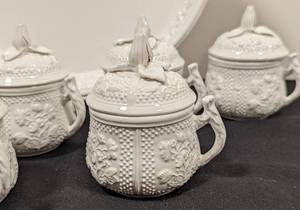 lot 372 image: Eight Museum Mottahedeh Pots de Crme and Platter