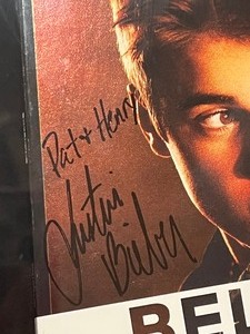 lot 395 image: Framed Signed I Believe Justin Bieber CD