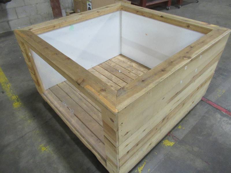 lot 239 image: Pallet-sized wooden retail display bin with plexiglass front window. Approximate Dimensions 50 x 50 x 30 Tall.