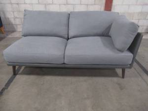 lot 409 image: CREATED FOR MACYs JASON FURNITURE Loveseat in Dove Gray With Leather Accents, Approximate Dimensions 68 x 35 x 27 Tall. In Like New Condition