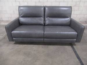 lot 416 image: CREATED FOR MACYs VIOLINO FURNITURE Leather Power Reclining Loveseat, in Gray, Approximate Dimensions 79 x 36 x 34 Tall. In Like New Condition.