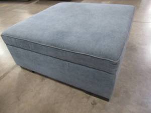 lot 441 image: CREATED FOR MACYs RADLEY FURNITURE  Storage Ottoman in Heavenly Naval, Missing Casters. In Like New Condition. Approximate Dimensions 36 x 36 x 15 12 Tall.