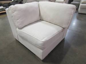 lot 446 image: CREATED FOR MACYs BETTER BY DESIGN FURNITURE Sectional Sofa Wedge in Alabaster White (Wedge Only). In Like New Condition. Approximate Dimensions 42 x 42 x 30 Tall.