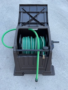 lot 4 image: Garden Hose and Reel