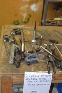 7 tubing benders, hacksaw wheel, ridged puller, pipe wrench