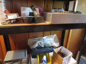 Two shelves, end mills, cutters, so...