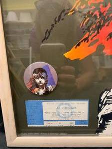 lot 40 image: Framed Poster, Ticket Stub and Button from Broadway Production of Les Miserables