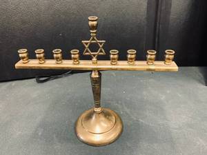 lot 89 image: Brass Star of David 9 Candle Menorah. Russian black metal medieval menorah.