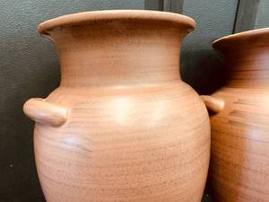 lot 101 image: Wall Mounted Terra Cotta Olive Oil Jugs