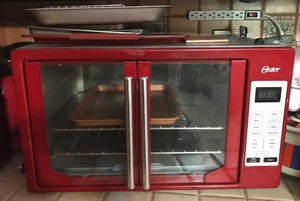lot 491 image: Large Red Oster French Door Toaster Oven