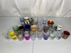 lot 219 image: 25 Tourist Shot Glasses