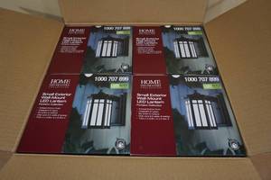 lot 104 image: NEW 4-Pack Small Exterior Wall Mount LED Lantern Fortston Collection -Antique Bronze