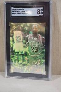 lot 66 image: 1991-92 Upper Deck Michael Jordan Award Winner Hologram Basketball Card - SGC 8